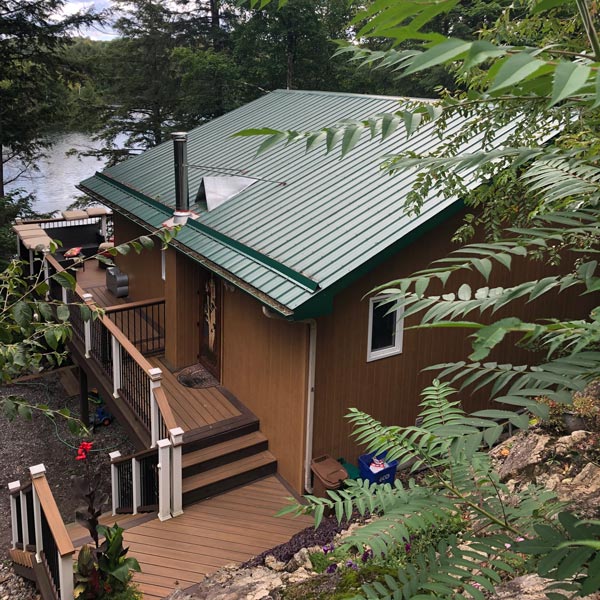 house with green metal roof